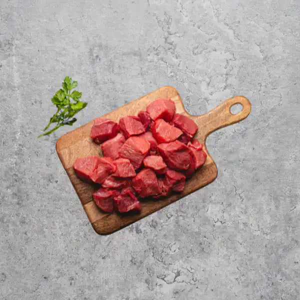 Diced Australian lamb on a light background.