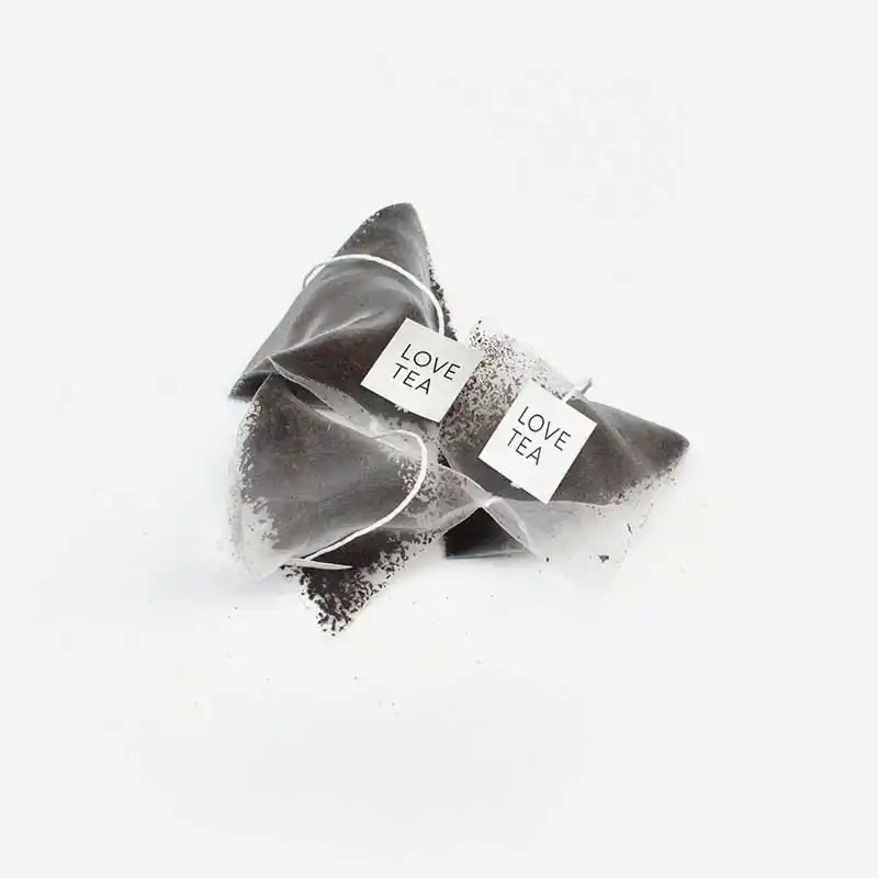 English Breakfast Tea pyramid bags on a white background.