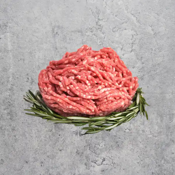 Fresh grass-fed Australian lamb mince on a light background.
