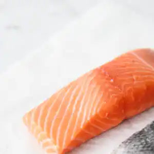 New Zealand King Salmon skin-off single portion fillet close-up.