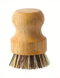 Natural bristle kitchen brush on a light background.