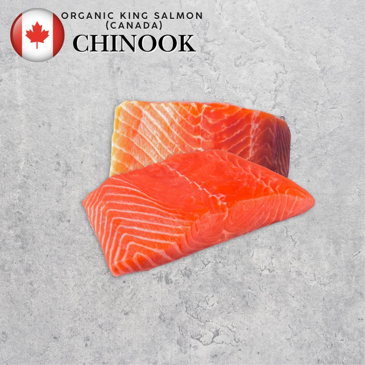 Two pieces of organic Chinook salmon on a gray surface with a Canadian flag label.