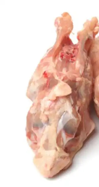 Certified organic chicken carcass pieces close-up.
