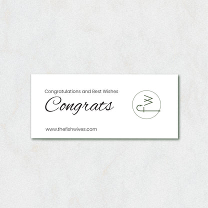 A white rectangular congratulations card with elegant black text reading 'Congratulations and Best Wishes Congrats' and the website 'www.thefishwives.