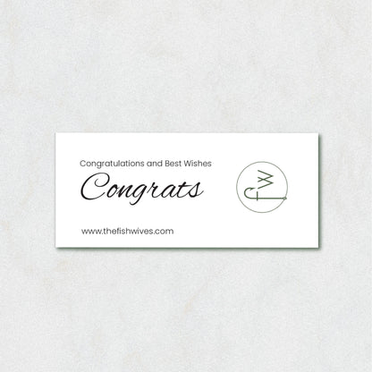 A white rectangular congratulations card with elegant black text reading 'Congratulations and Best Wishes Congrats' and the website 'www.thefishwives.