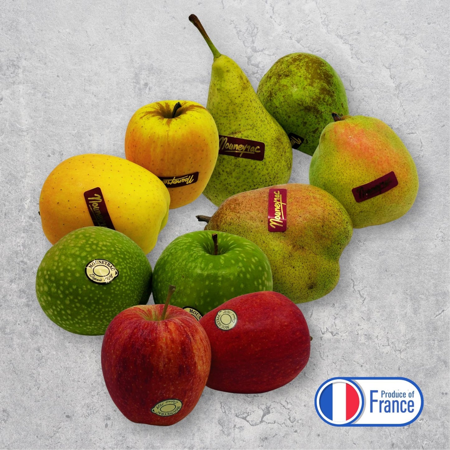 Assorted apples and pears with 'Produce of France' label on a textured surface