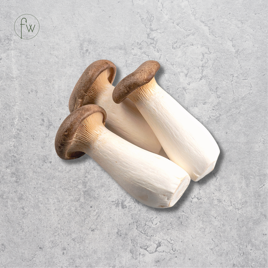 Three shiitake mushrooms with brown caps and off-white stems arranged on a textured light gray background. A small circular 'fw' logo appears in the top-left corner.
