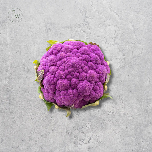 A whole purple cauliflower head with a few green leaves, centered on a textured light gray background. A small circular 'fw' logo appears in the top-left corner.