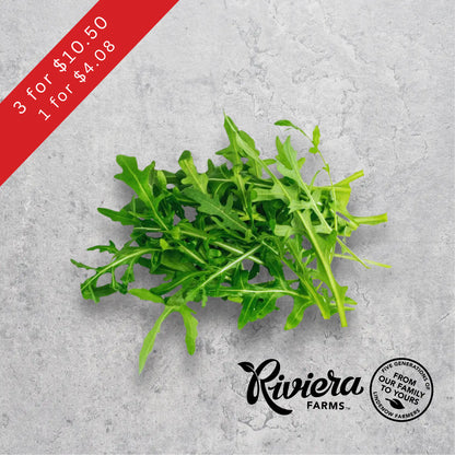 Rocket salad leaves, Riviera Farms, on a light background.