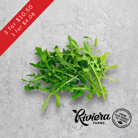 Rocket salad leaves, Riviera Farms, on a light background.