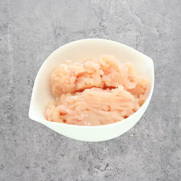 Certified organic chicken breast mince on a light background.