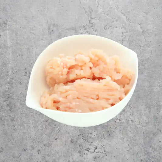 Certified organic chicken breast mince on a light background.