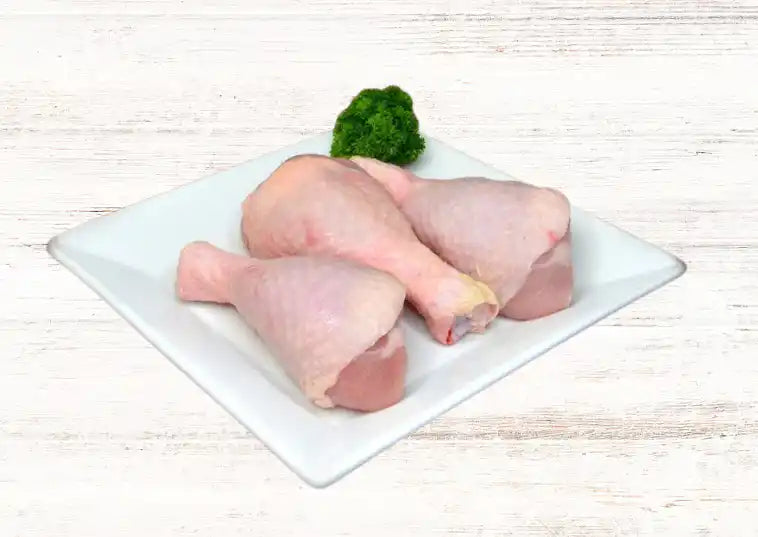 Certified organic chicken drumsticks close-up.