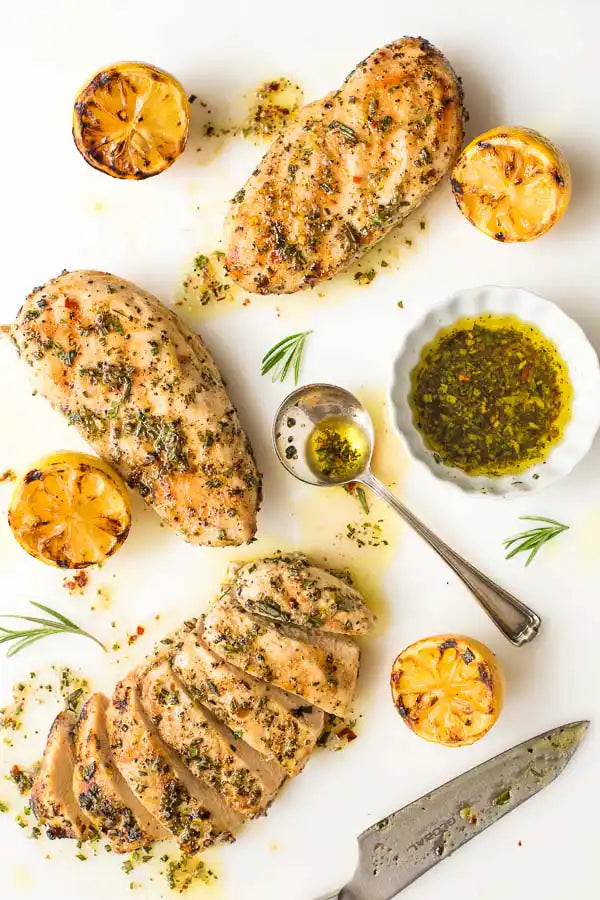 Lemon, garlic and rosemary marinated chicken breast in packaging.