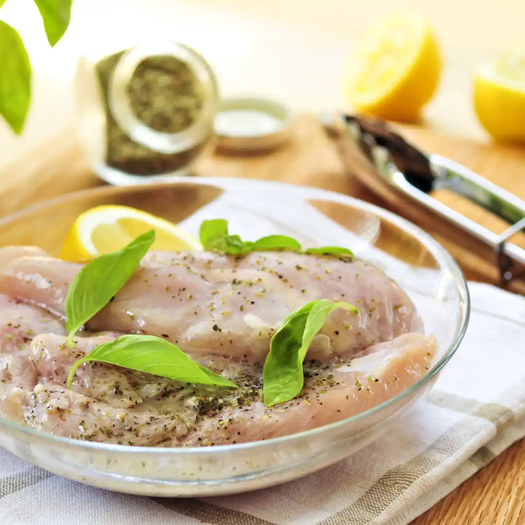 Marinated certified organic chicken breast supreme, cooked and plated.