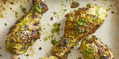 Pesto marinated chicken drumsticks in packaging.