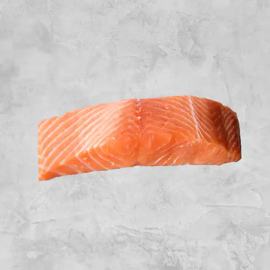 New Zealand King Salmon skin-off single portion fillet on a light background.