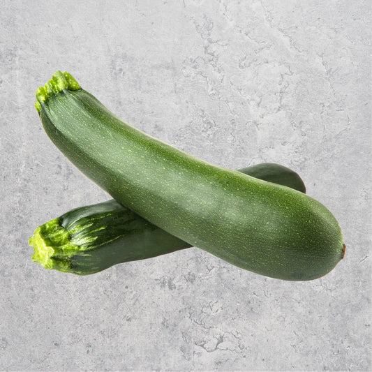 Fresh zucchini on a light background.